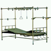 Traction bed with stainless steel sloped surface