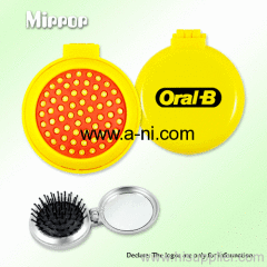 Mirror and comb with colored outer skin