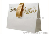 white Kraft paper bag with nylon handled