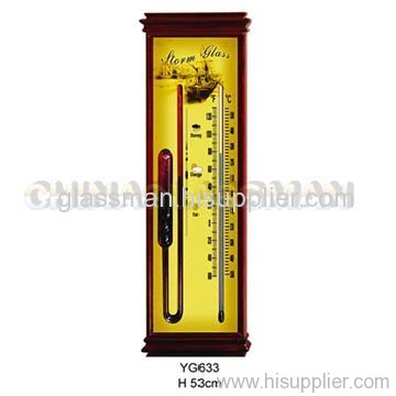 Glass barometer with wood frame