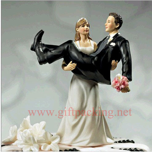 "To Have and to Hold" - Bride holding Groom Figurine