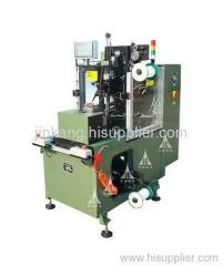 Coil lacing machine