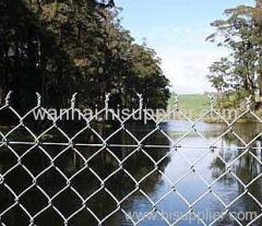 chain link fence with a barbed top