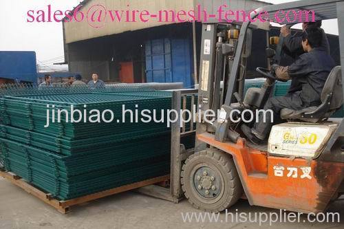 Dark green wire mesh fence