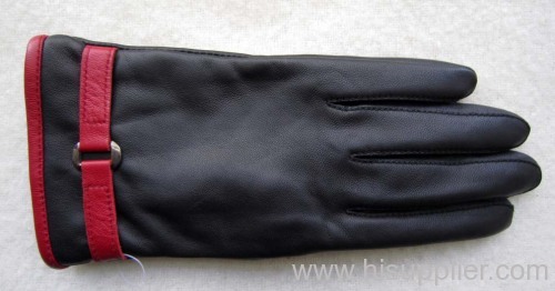 leather gloves with leather chain and a metal button
