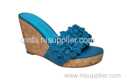 suede flowered wedge shoe