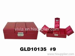 glossy red leahter jewelry box with many drawers