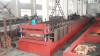 Steel deck floor forming machine