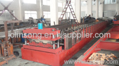 Steel deck floor forming machine