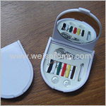 Foldable compact mirror with sewing kit