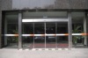 Automatic sliding door mechanism for banks