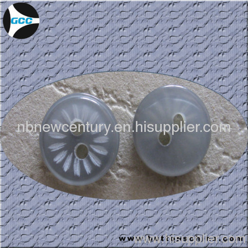 grey button with engrave design