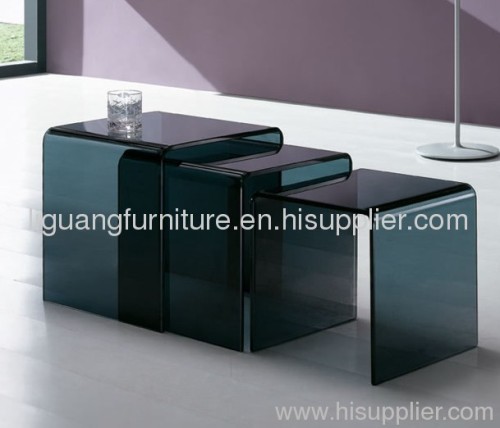 Nest of bent glass tables