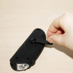 Dynamo LED flashlight with travel tools