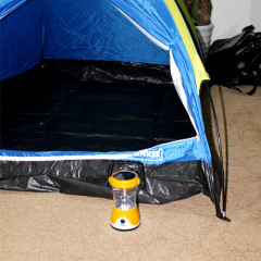 Solar camping light with solar panel on top