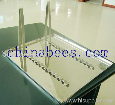 metal uncapping tray