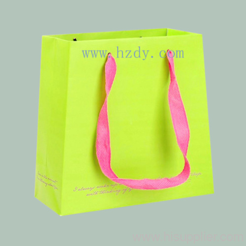 Printed paper bag with woven tape handle