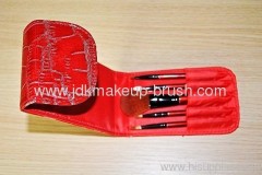 red travel brush set with case