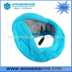 Blue back wearing knitted earmuff with bass speaker