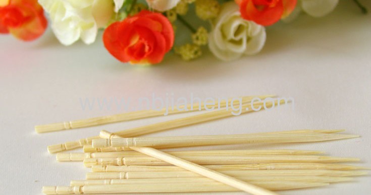 Disposable natural bamboo toothpick in individual paper wrapper