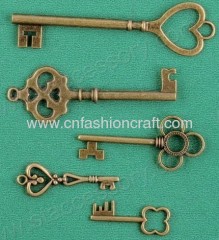 Key shaped metal trinket