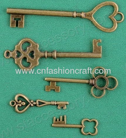 Key shaped metal trinket