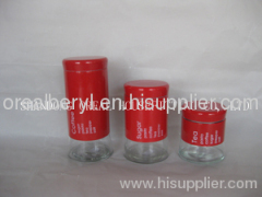 red glass canisters