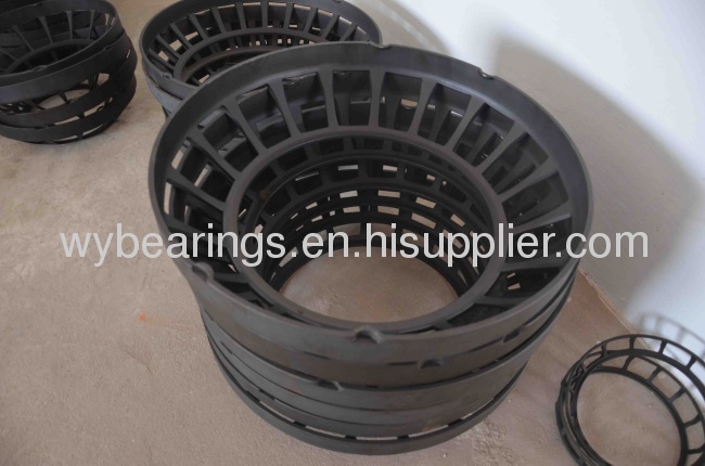 Pressed cage for spherical roller thrust bearing