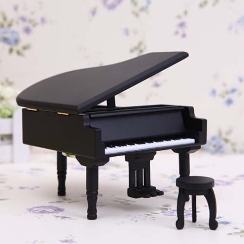 Black wooden ring box grand piano emulation