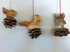 Hand carved wooden animal head on pine cone