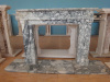 Freestanding stone fireplace frame