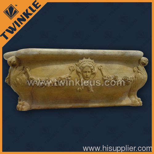 carved natural stone bathtub