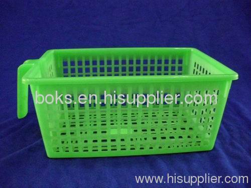 green plastic soft storage basket