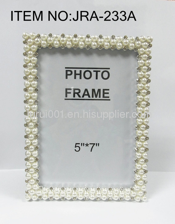 Metal photo frame with pearls and crystals