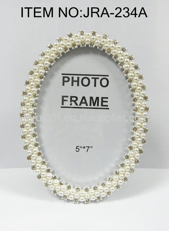 Metal photo frame with pearls and crystals