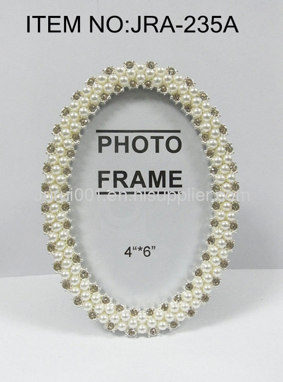 Metal photo frame with pearls and crystals