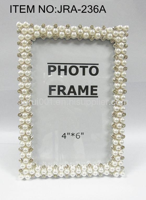 Metal photo frame with pearls and crystals