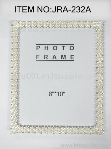 Metal photo frame with pearls and crystals