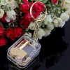 The new mini-gold-plated movement square keychain music box music box creative and practical