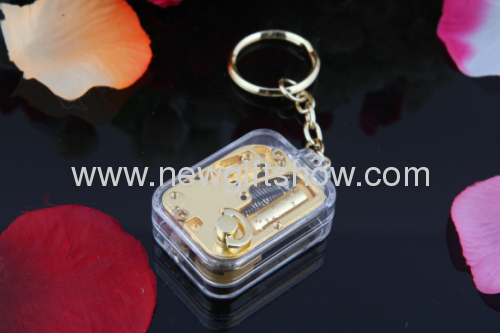 The new mini-gold-plated movement square keychain music box music box creative and practical
