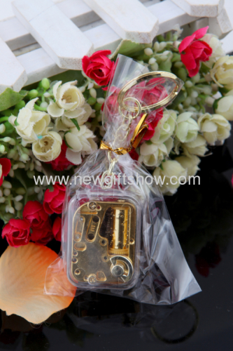 The new mini-gold-plated movement square keychain music box music box creative and practical