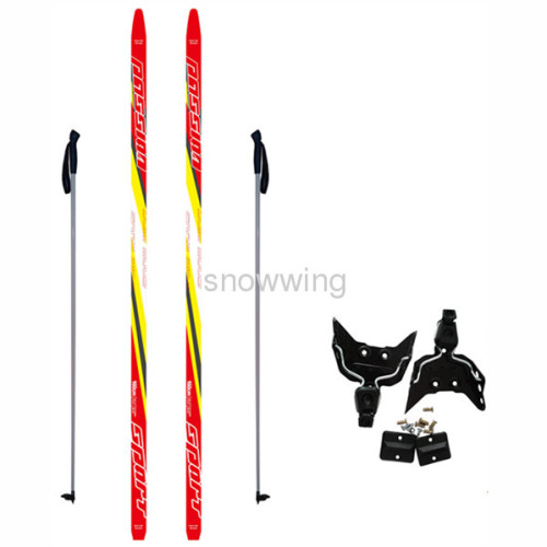 cross-country ski set and snowboard