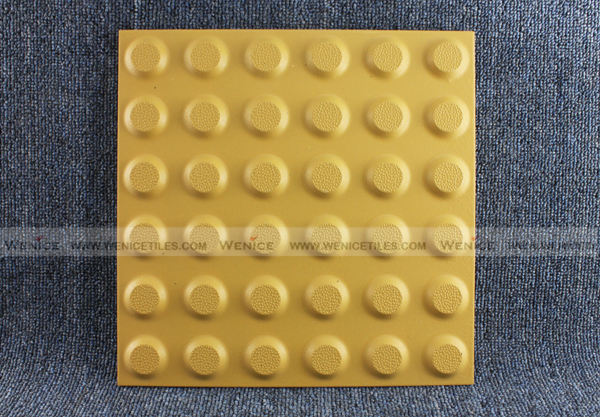 Tactile warning tile with dot design