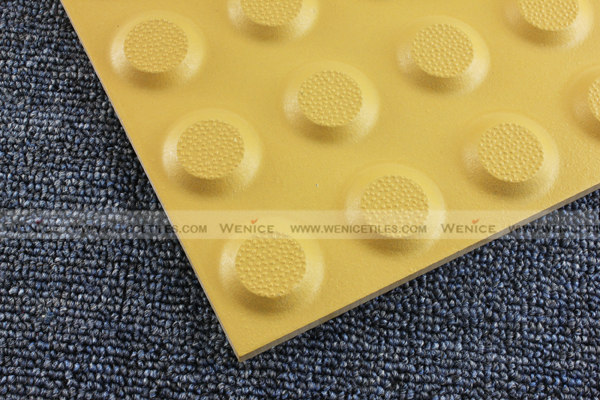 Tactile warning tile with dot design