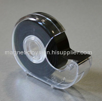 Adhesive flexible magnet with tape dispenser 