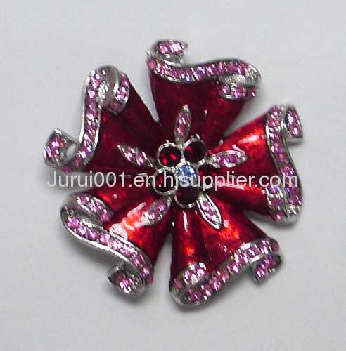 Metal brooch with flowers and crystals