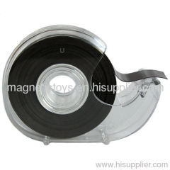 Adhesive flexible magnet with tape dispenser