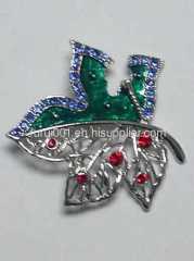 Metal brooch with flowers and crystals