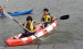 three person sit on top fishing kayak