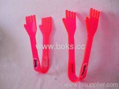 pink plastic food tongs